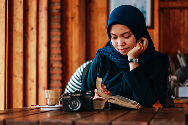 Muslim woman reading