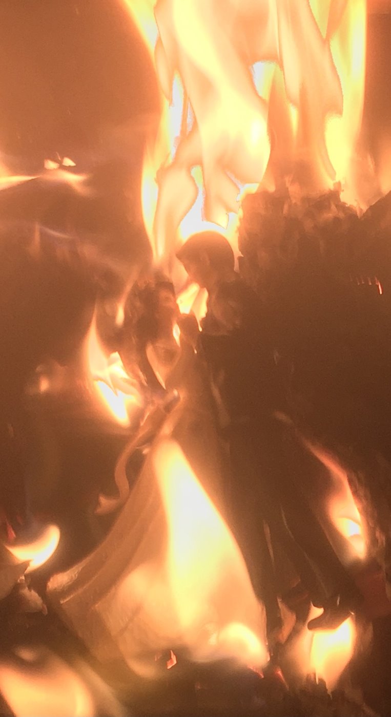 Photo: Wedding bride-and-groom topper burning in a fire