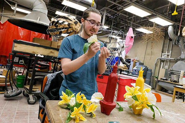 Student working backstage of a production