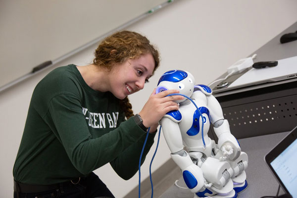 Female student working on robot
