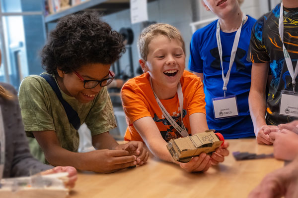 Group of children laugh at camp