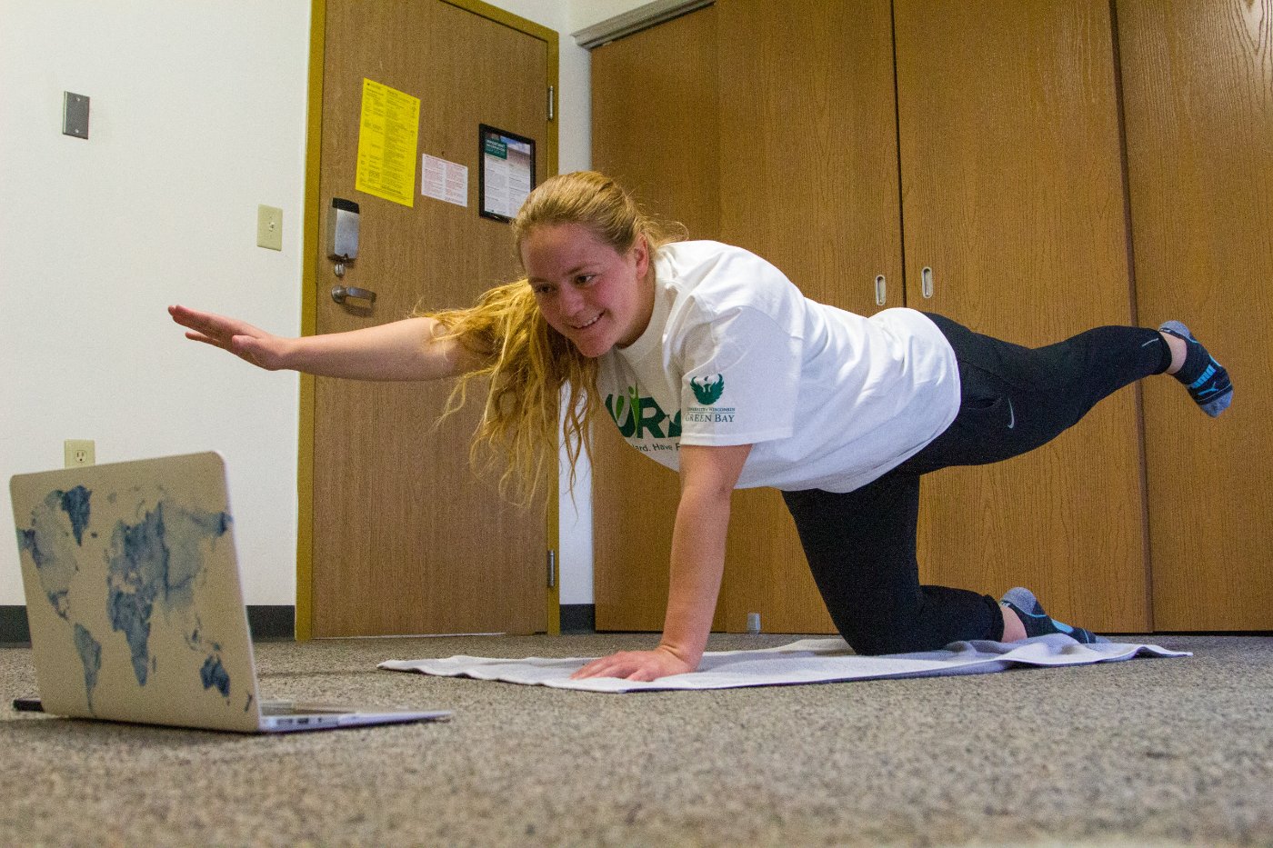 Female student working out in dorm