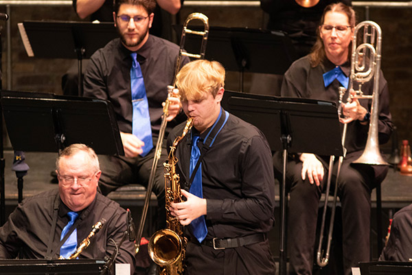 Saxophone playing solo in band concert