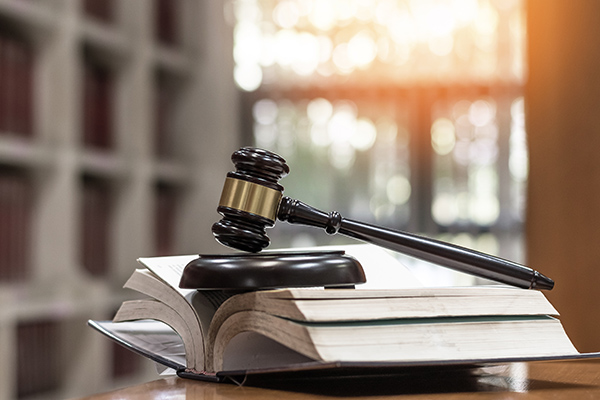 Gavel on a book in sunlit room