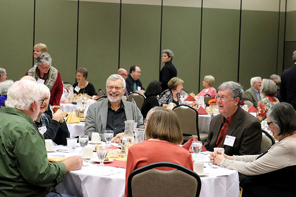Retiree banquet attendees around tables