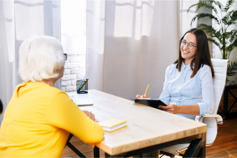 Younger female interviewing and older female
