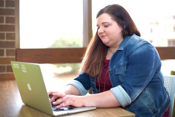 Student works on laptop