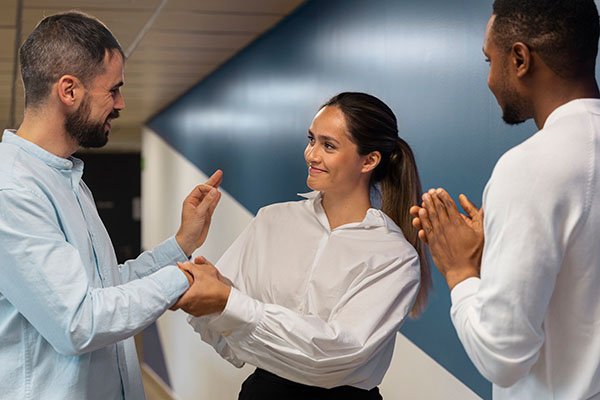 woman getting praise from team