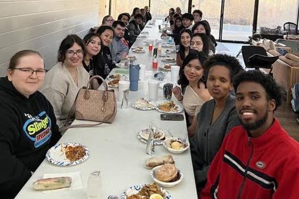 Multiple people sitting at a table for dinner