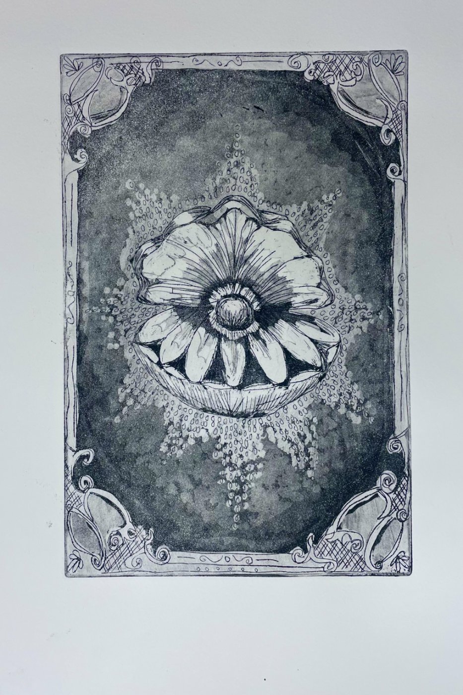 Black and white illustration of an oriental-style rug.