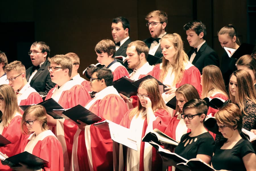 Choir students performing in Theatre Hall