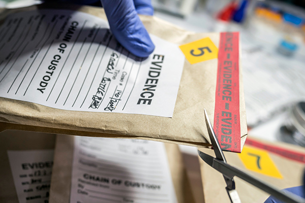 Sealed evidence package being opened