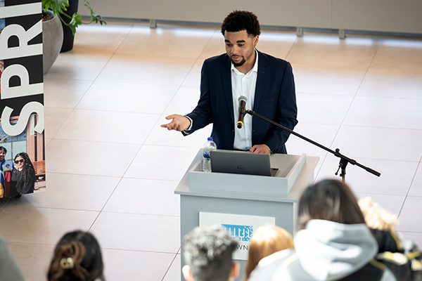 Speaker at podium for a Cofrin School of Business event