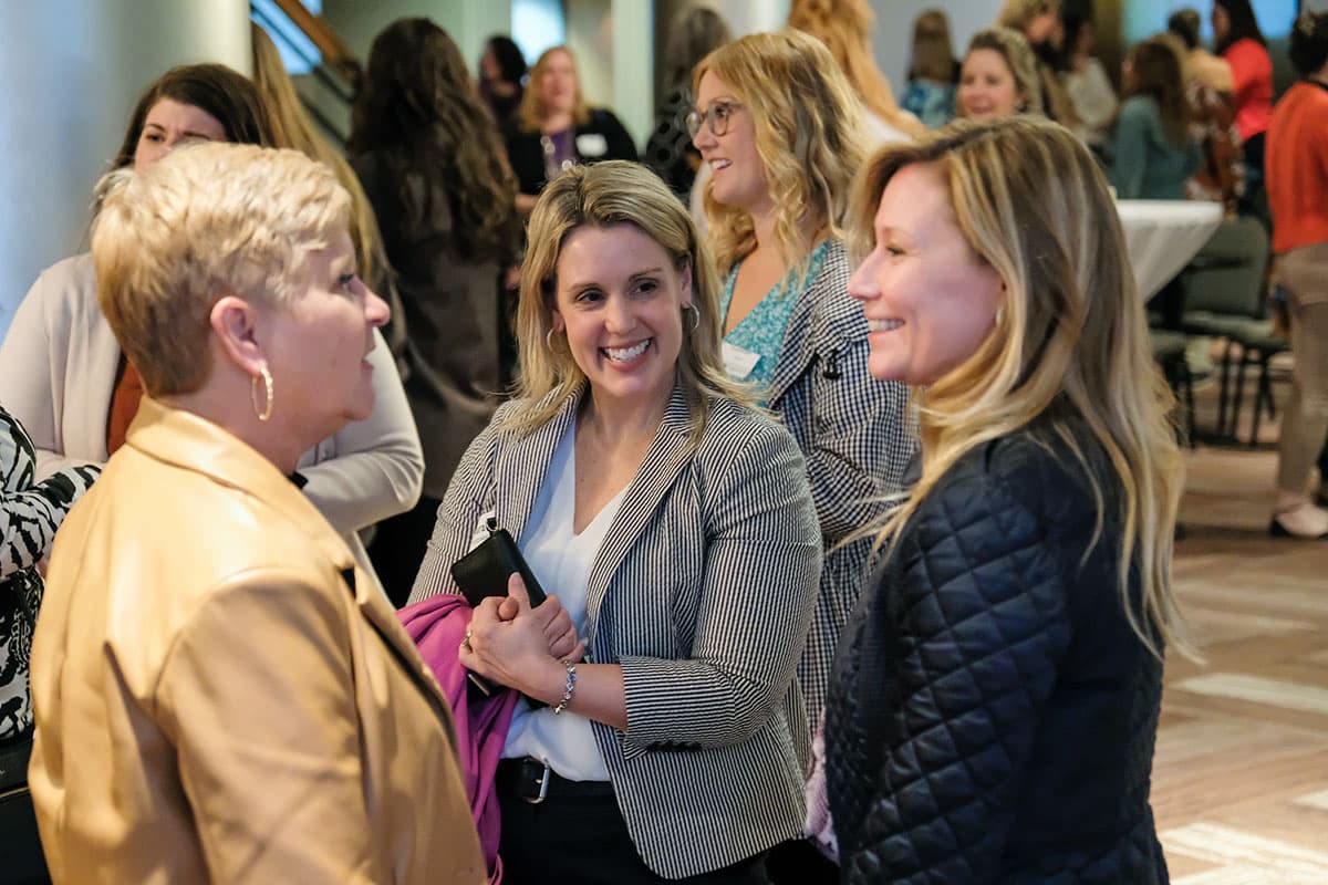 Group of women talking in Weidner lobby