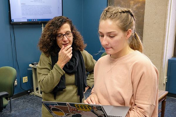 Teacher and student consulting in Language Resource Center