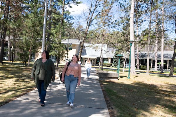 Marinette campus students walk from the main building.