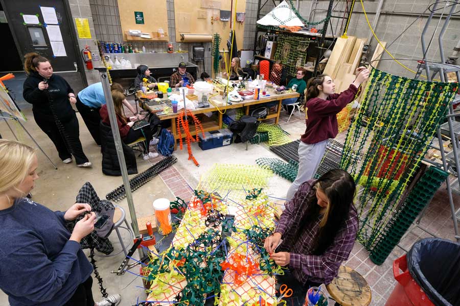 Birds eye view of students working in sculpture studio