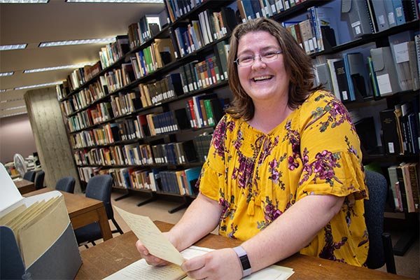UWGB student Michelle Haapala workign in the Archives