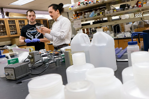 Mike Holly in lab with student