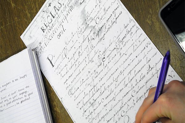 Spanish language students translating rules from archbishop