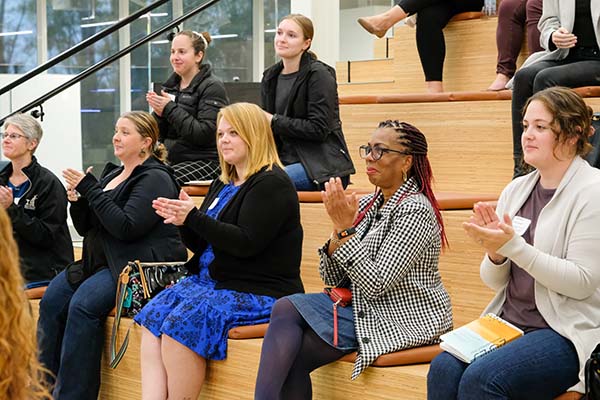 audience at event clapping