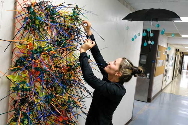 Artist working on a sculpture.