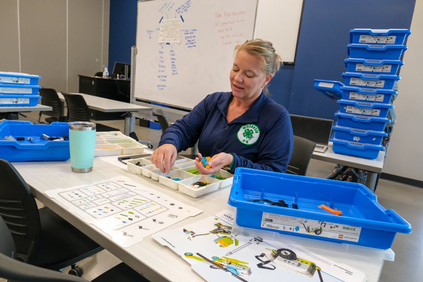 staff member assembling lego project