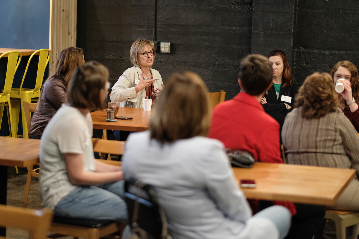 Woman conversing over coffee