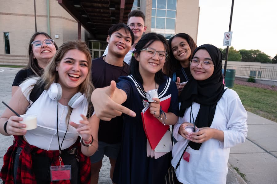 Group of students participating in a campus tradition: painting the phoenix