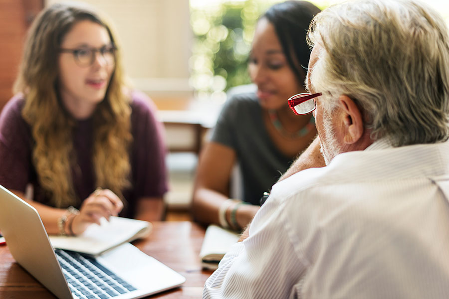 Employees discussing with supervisor
