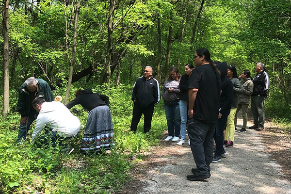 Oneida Nation members on a wooded trail