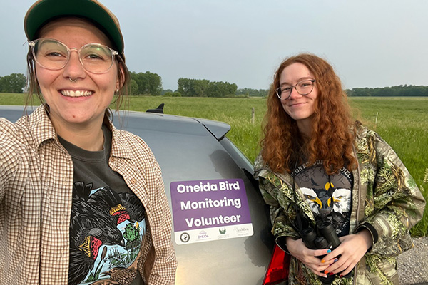 Two bird monitoring volunteers