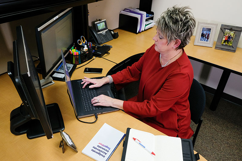 lisa jossart sitting working at desk