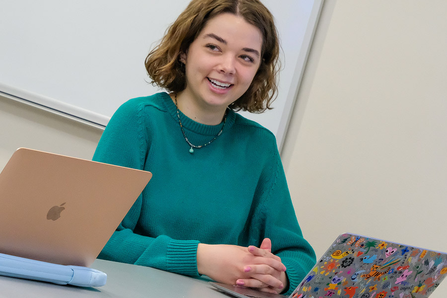 Smiling student with laptop