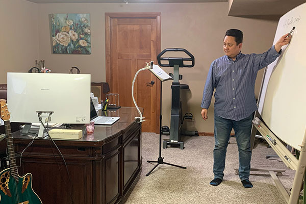 Professor teaching virtually from his home office