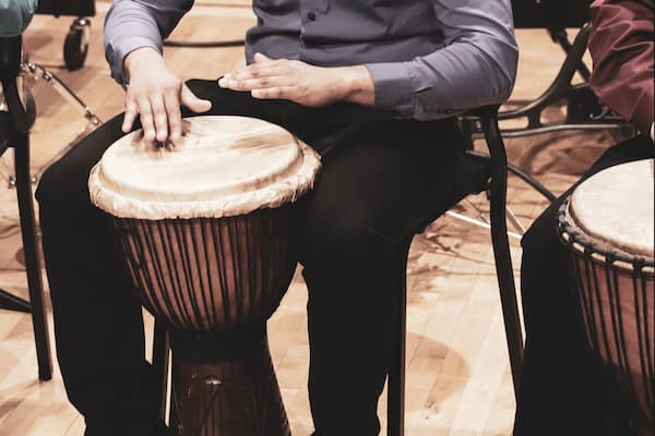 Student plays the bongo drums