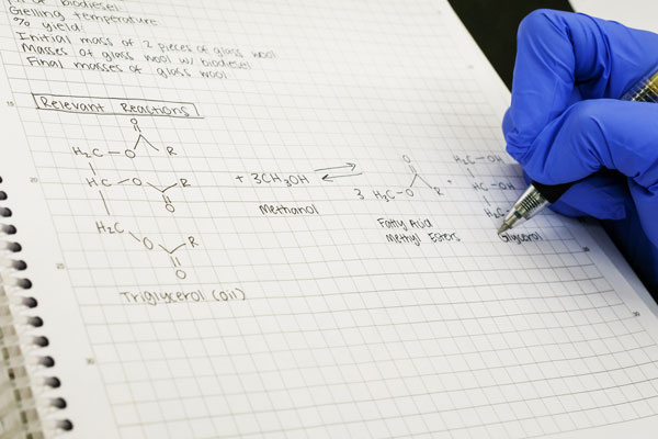 Student taking chemistry notes
