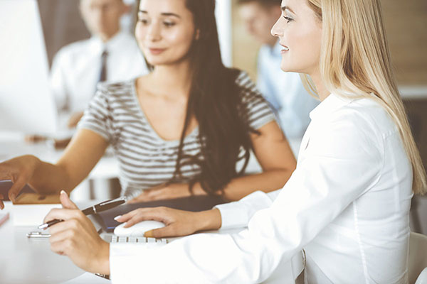 two women working together
