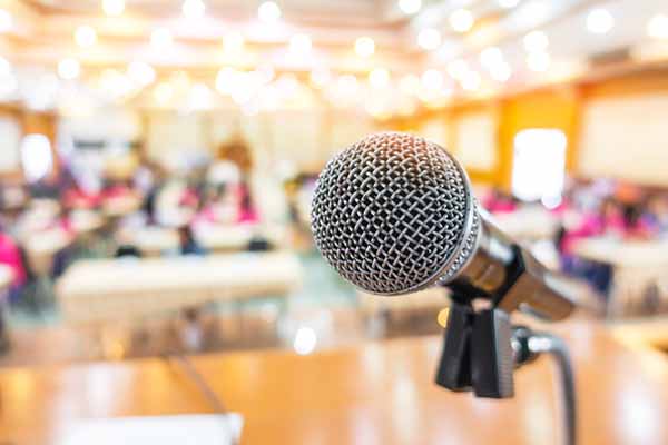 microphone at front of conference presentation