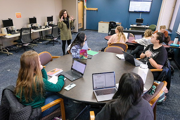 Teacher and students in the Language Resource Center