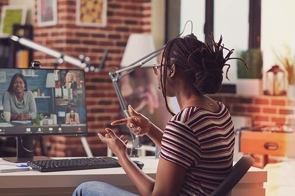 student attending a virtual meeting