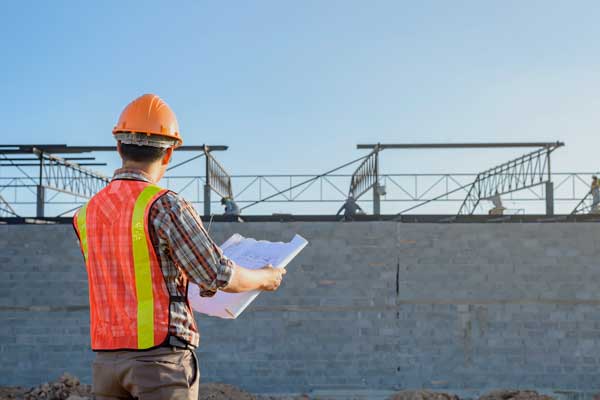 Environmental Engineer overlooks solar panels