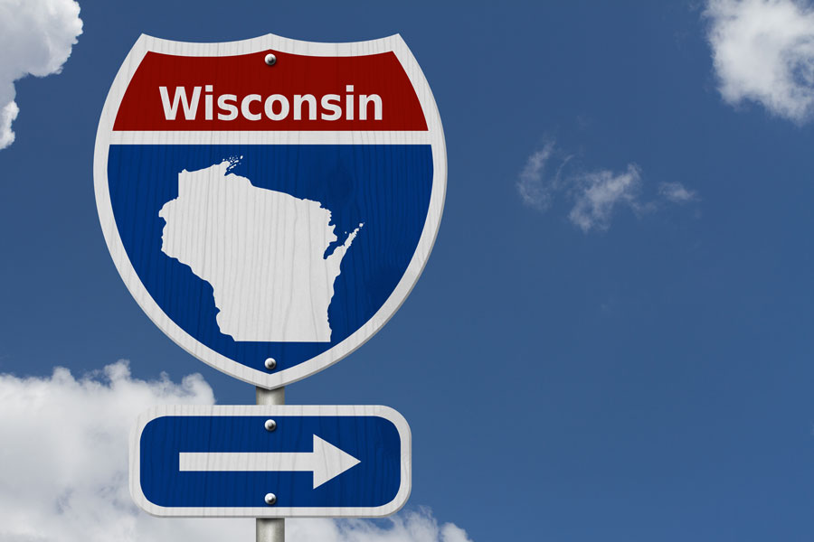 Road sign showing direction to Wisconsin