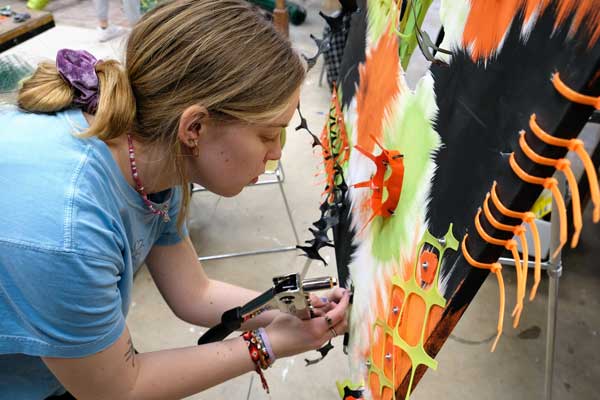 Student works on sculpture