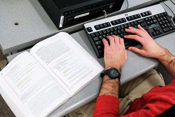 Birds eye view of student typing