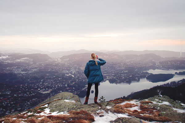 Female looking over vast mountainous landscape