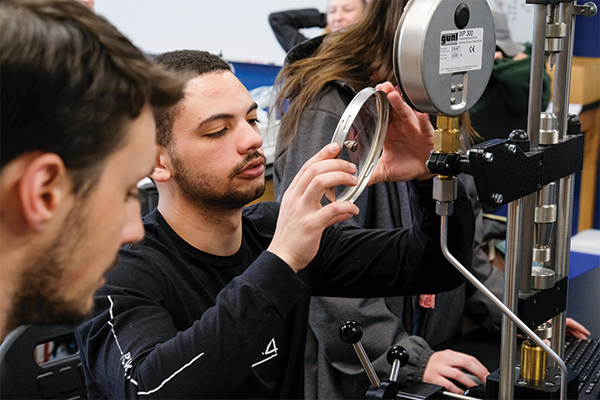 Mechanical engineering students work on a project.