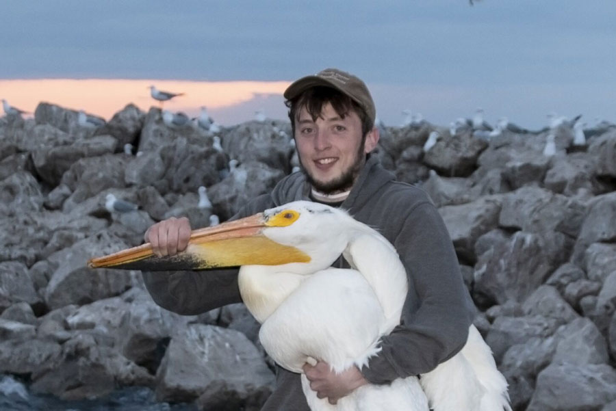 Student holding pelican
