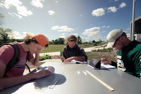 Male students study outside