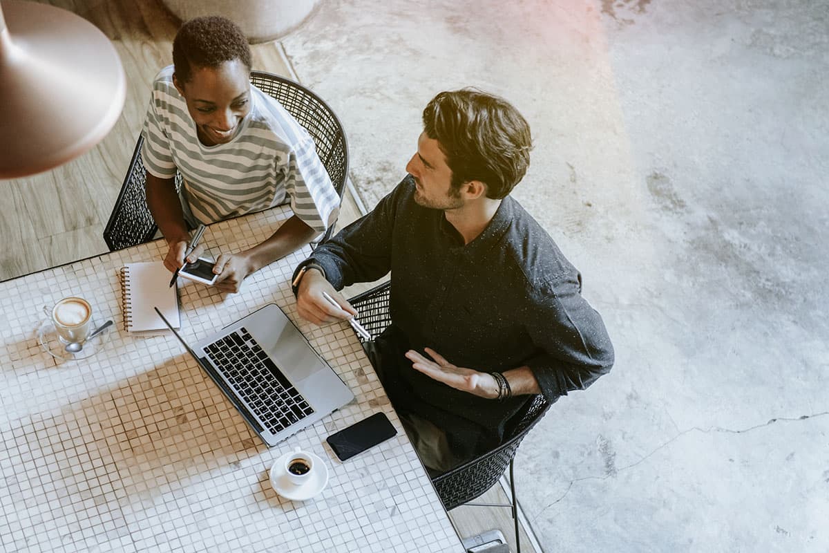 colleagues discussing their work